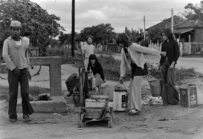 Vila Restinga; people and streets; getting water.  