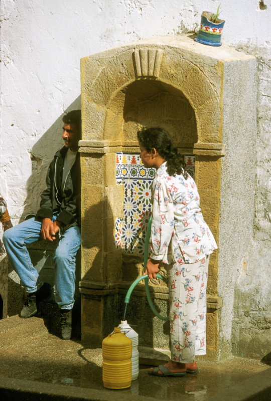 At a well in the Mellah, the old Jewish Quarter of Essaouira, Morocco
