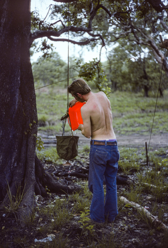 A geologist prepares his camp shower at Daly River, Northern Territory