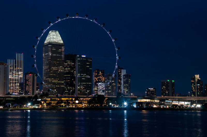 Downtown Singapore and the Singapore Flyer observation wheel, by night