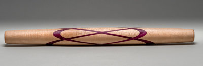 Maple rolling pin with a Celtic Knot out of Purple Heart.