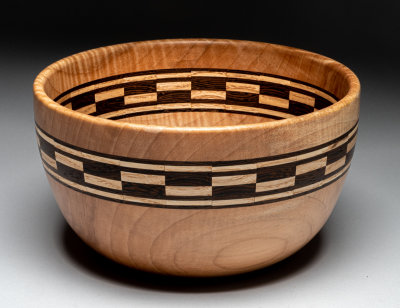 Maple bowl with segmented ring.