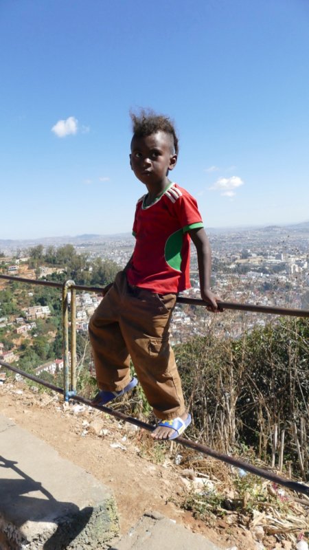 Kid at viewpoint overlooking Tana