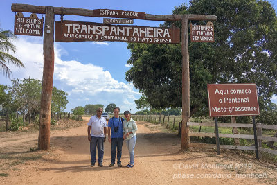 Group photo (Driver, myself and our official tour guide Lorinete) at the entrance of the Pantanal, south of Pocon (Mato Grosso)