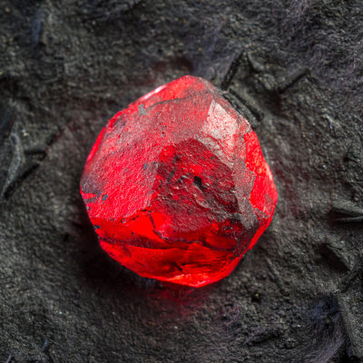 Almandine, 16 mm euhedron in graphitic schist with tiny dravite prisms, Red Embers Mine, Erving, Massachusetts, USA