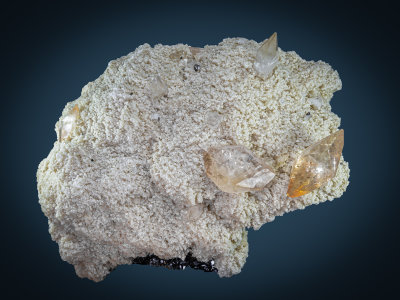 Calcite twins to 65 mm (15 of them) on baryte on sphalerite,  Elmwood, Tennessee