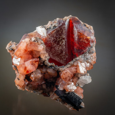DSC00894.jpgTwinned crystals of tabular rhodochrosite to 11 mm on edge, Mont Saint Hilaire, Quebec, Canada
