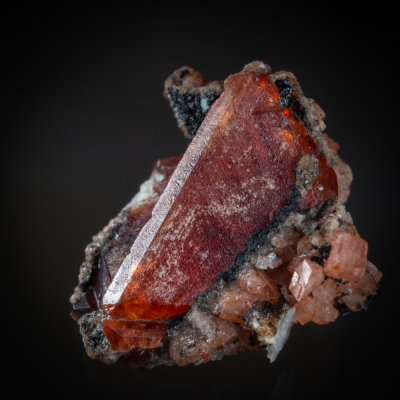 Tabular triangular rhodochrosite crystal from Mont Saint Hilaire, 17 mm on edge