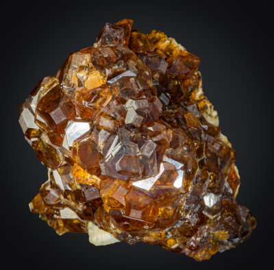 Group of grossular crystals showing dodecahedron, cube and in some cases tetrahexahedron, Vesper Peak, Washington, 5 cm