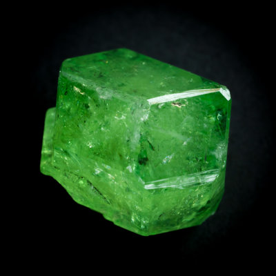 Tsavorite crystal, 15 mm, Merelani Hills, showing tetrahexhedron face