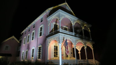 The pink house at night