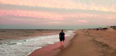 Walking along the surf at sunset time - Belmar, New Jersey