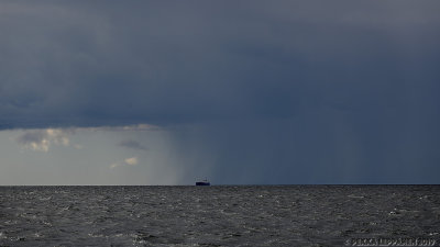 Ship coming out of rain / Rain on the sea