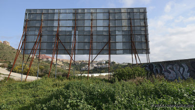 Behind the sign