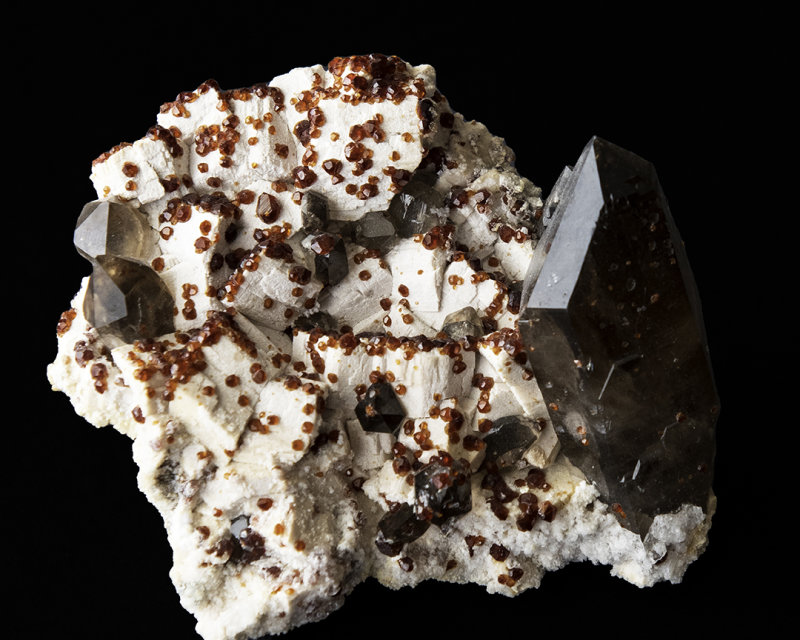 Garnet and Smokey Quartz, on Potassium Feldspar matrix
