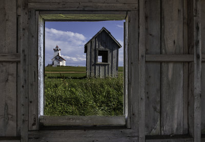 Wood Islands Lighthouse through a shack window, PEI