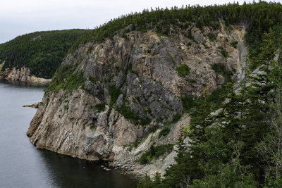 Dike cutting through Granite along White Point Road at Aspy Bay, Nova Scotia