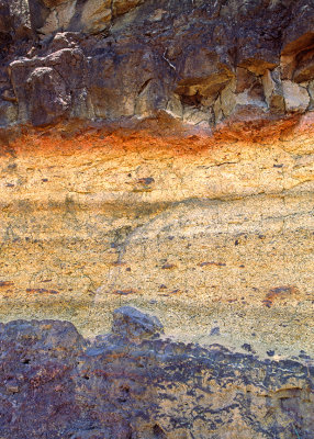 Baked zone (reddish layer) on tuff underlying a lava flow, Kauai, HI