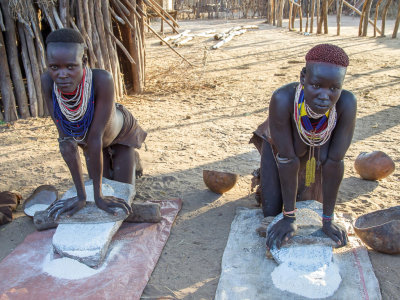 Karo girls grinding sorghum