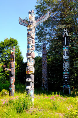 KakasoLas Totem Pole (center) and Chief Wakas Totem Pole (right) and Oscar Maltipi Totem Pole (left)