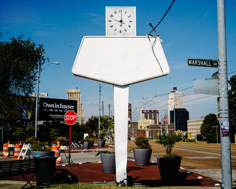 Clock and White Sign