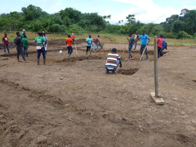 Liberia, students building pond at Tubman University