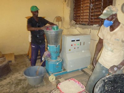Senegal - government mixing fish feed ingredients for farmers