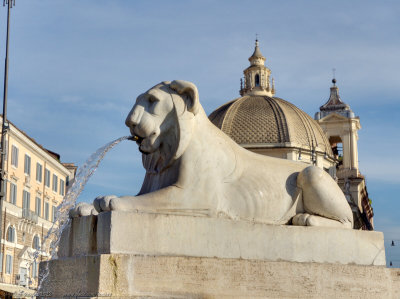 Lion statue beside obelisk