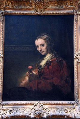 Woman with a Pink (early 1660s) - Rembrandt - 1342
