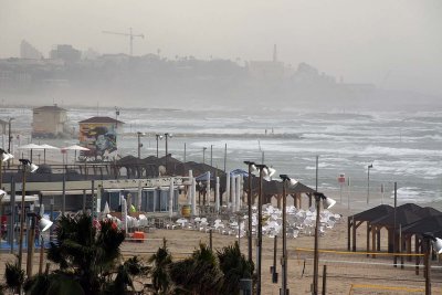 Beachfront in stormy weather, Jaffa in the distance - 6357