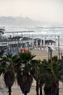 Beachfront in stormy weather, Jaffa in the distance - 6362