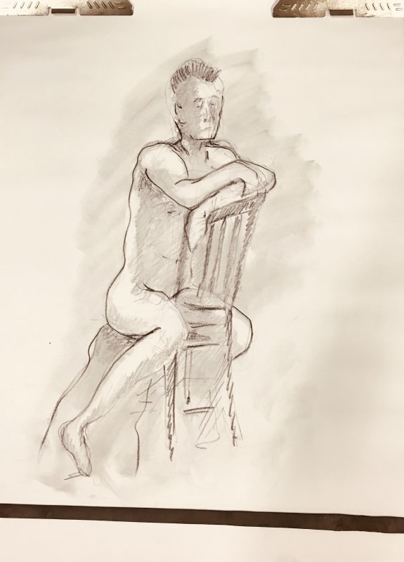Figure seated at Chair