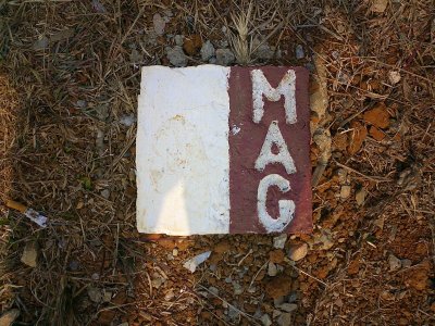 MAG Minefield marker. Stay between the markers and you should be fine. - near Phonsavon