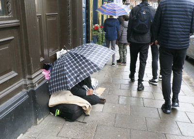 On the pavement across the road from Windsor Castle.