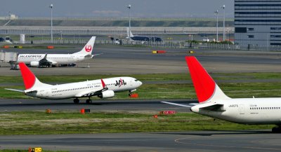 Two Sun Tails: JAL's B-737/800, JA318J, TO
