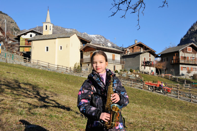 Aosta Valley region, playing sax in the village of Cerian