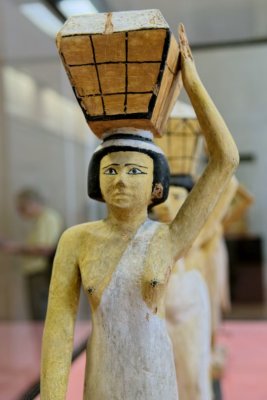 Statuette of woman bearing offerings