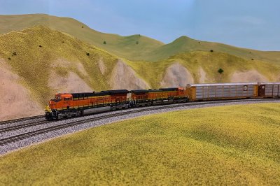 BNSF 4395, a suctom numbered ScaleTrains C44-9W behind.