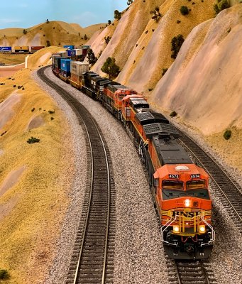 BNSF 4574 leads four sound equipped Rivet Counter Series ScaleTrains C44-9Ws with a 46 well double stack train in tow.