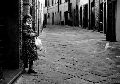 Lonely woman in an empty street