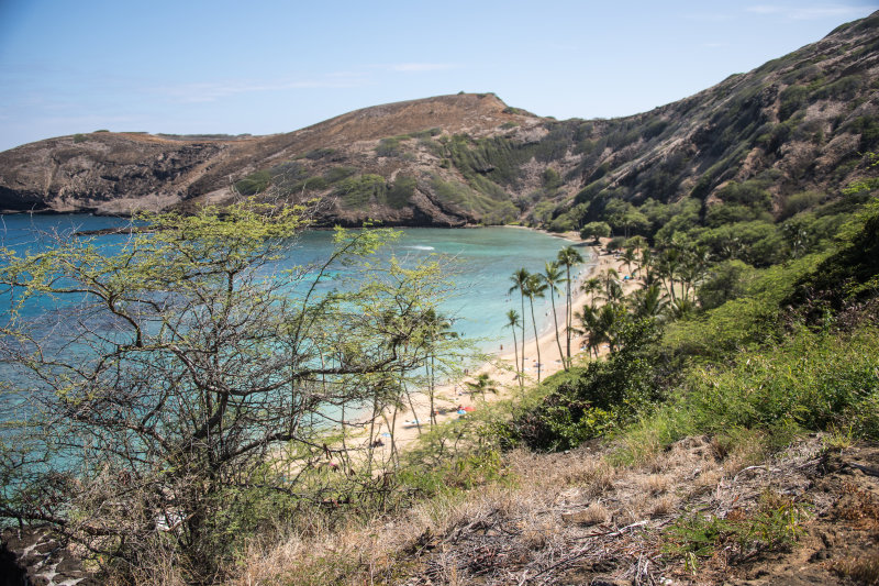 People on the beach at foot of Diamond Head