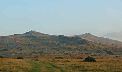 Belstone tors in soft evening light as the sun goes down