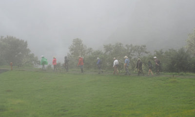 Walkers in the mist at Machu Picchu