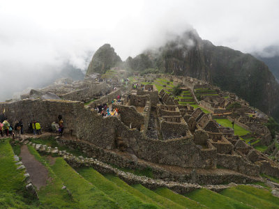 At an entrance to the Machu Picchu ruins after the fog rises