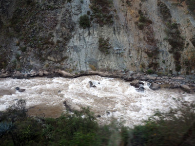The Urubamba river flows next to the train tracks to Machu Picchu