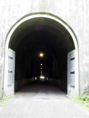 Headlights approach from inside Big Savage Tunnel
