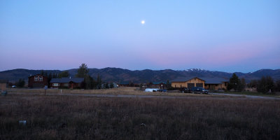 Moon setting in the morning in Victor, Idaho