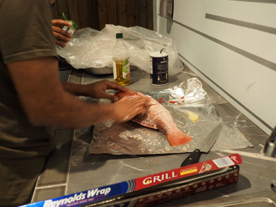 Seasoning the fish before grilling