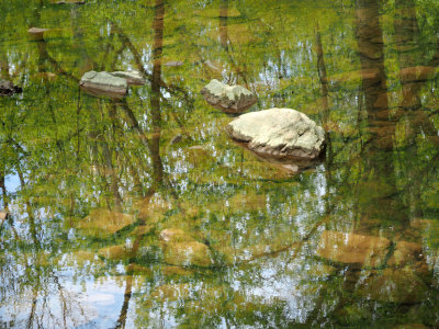 Calm water of the creek that passes under the canal