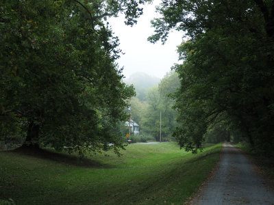 Houses come into view beside the canal bed